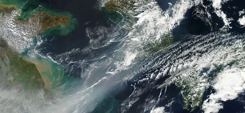 Figure 3.1 A weak cold front of air pushes all the smog in northeastern China into a giant smog blanket over the Yellow Sea, as captured by NASA’s Terra satellite in 2012. To understand changes in weather and climate, such as the event shown here, you need a thorough knowledge of thermodynamics. (credit: modification of work by NASA)